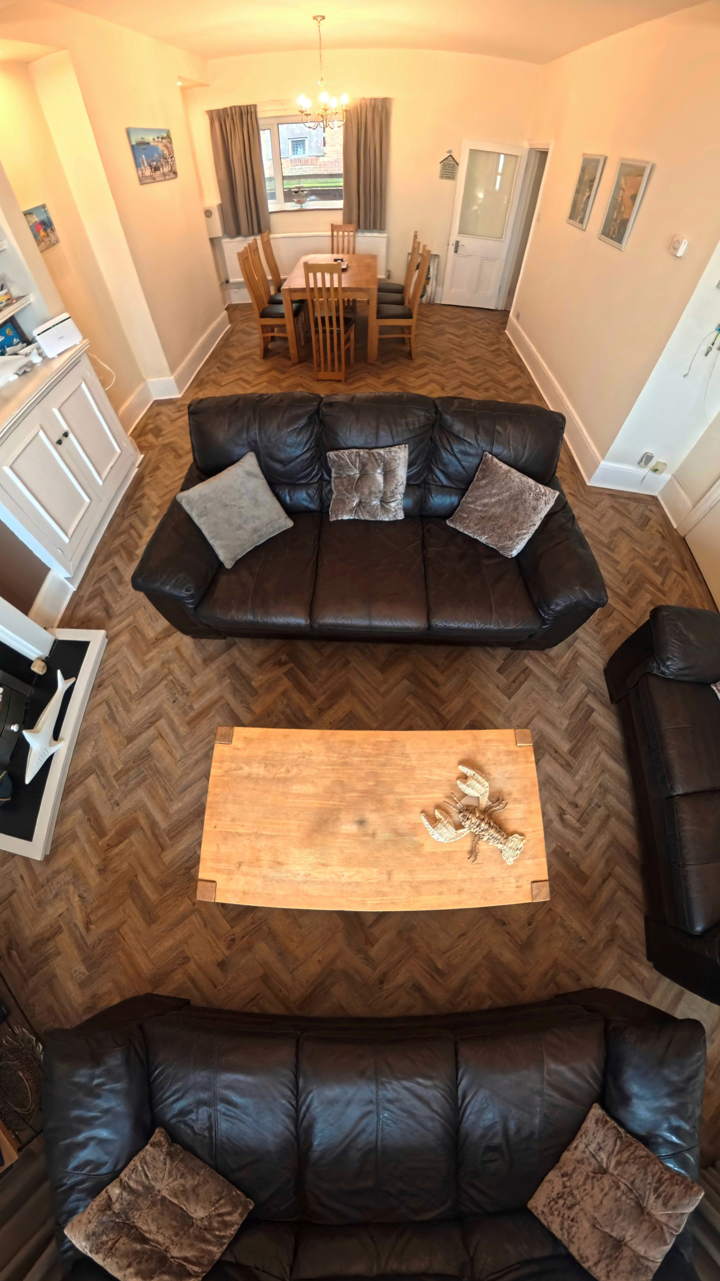 A herringbone LVT flooring install in a home in Swanage using Polyflor's Cambridge Parquet tile.